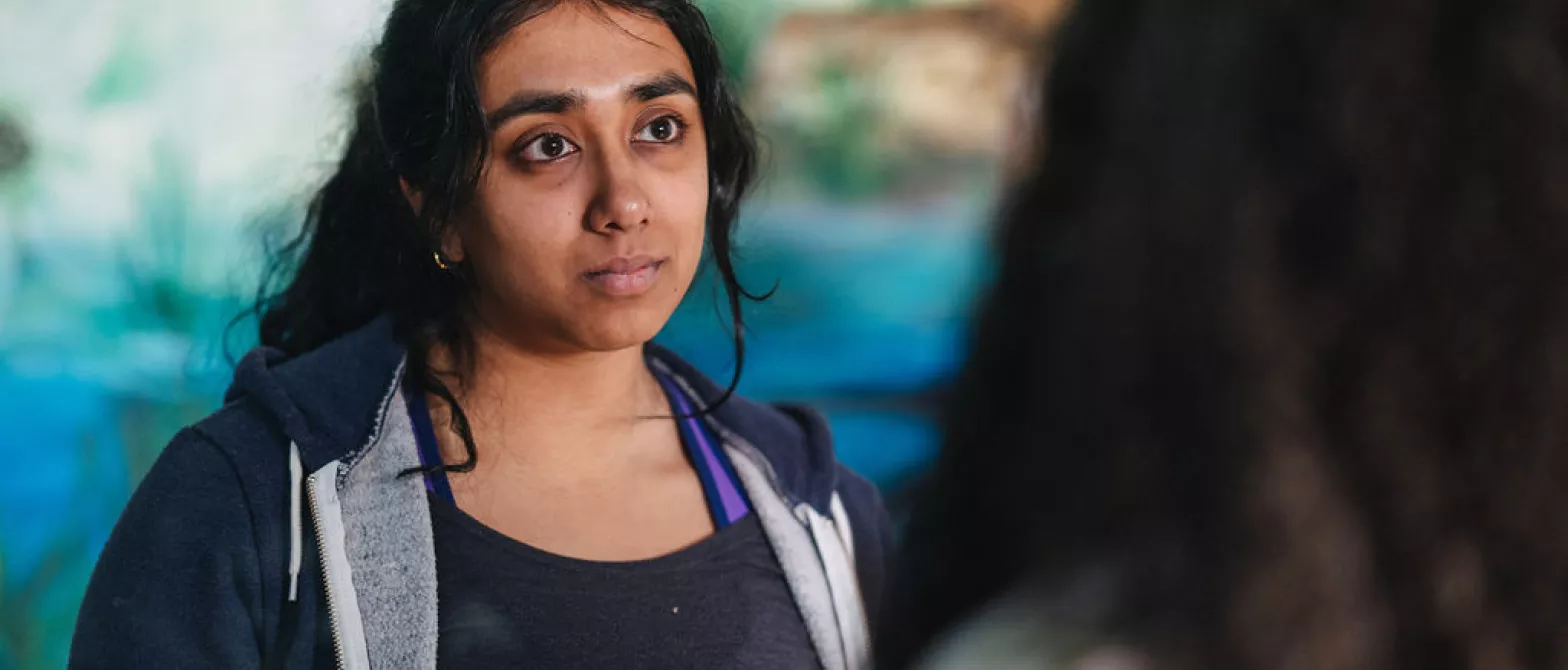 Woman listening to another woman