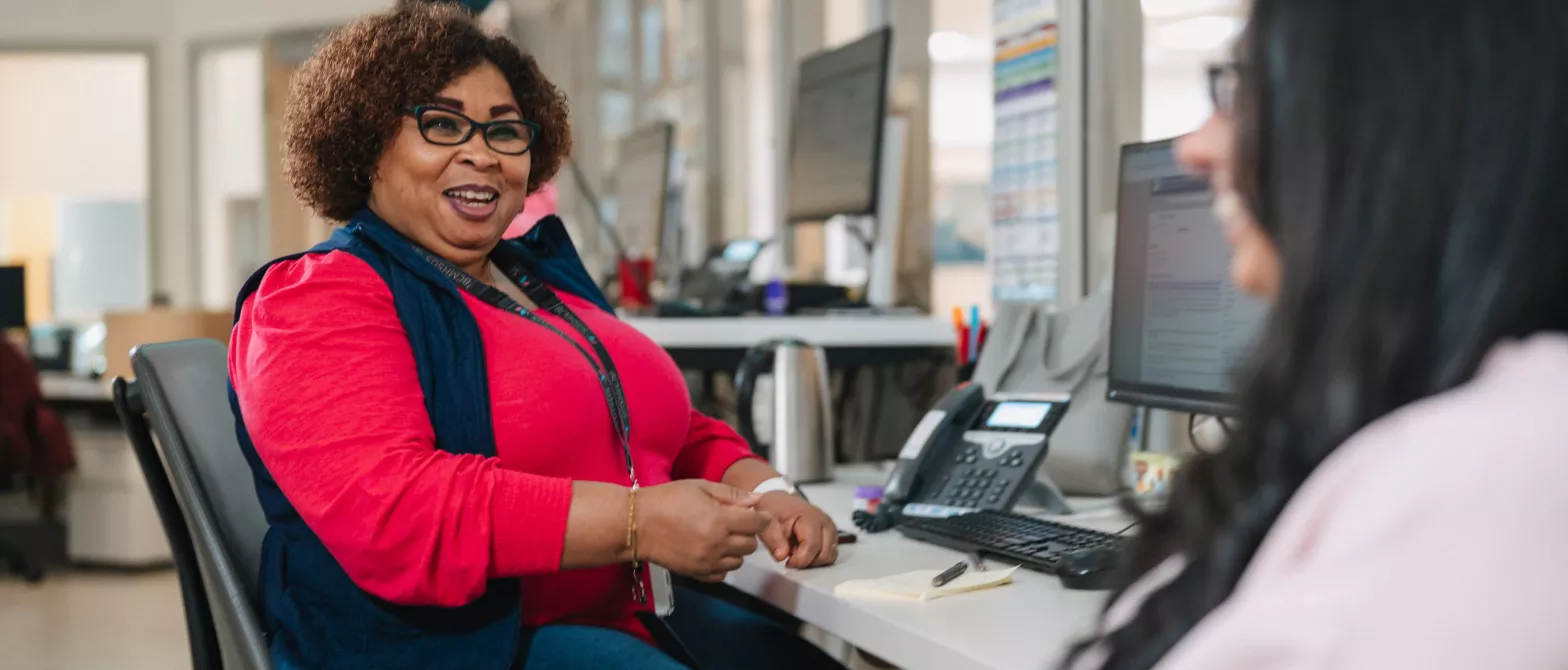 A BCMHSUS support worker at their desk