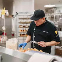 Man works in commercial kitchen. 