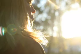 Close-up of woman with sunlit hair
