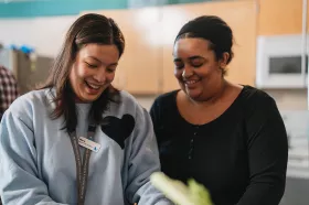 BCMHSUS staff member and patient smiling and working together