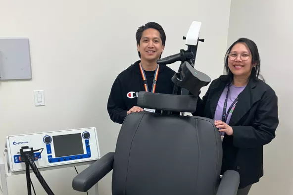 Nurses Vinson Francisco (left) and Maricel Jimena-Born (right) with the transcranial magnetic stimulation device at Red Fish Healing Centre for Mental Health and Addiction.