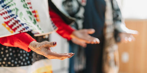 hands palms up in Indigenous traditional welcoming gesture
