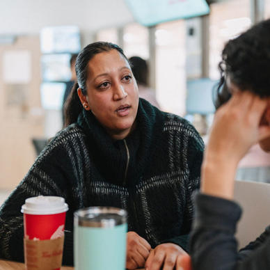 Two women talking over coffee