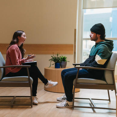 Two people talking in a counselling session