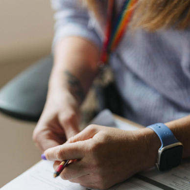 Woman holding pen and clipboard