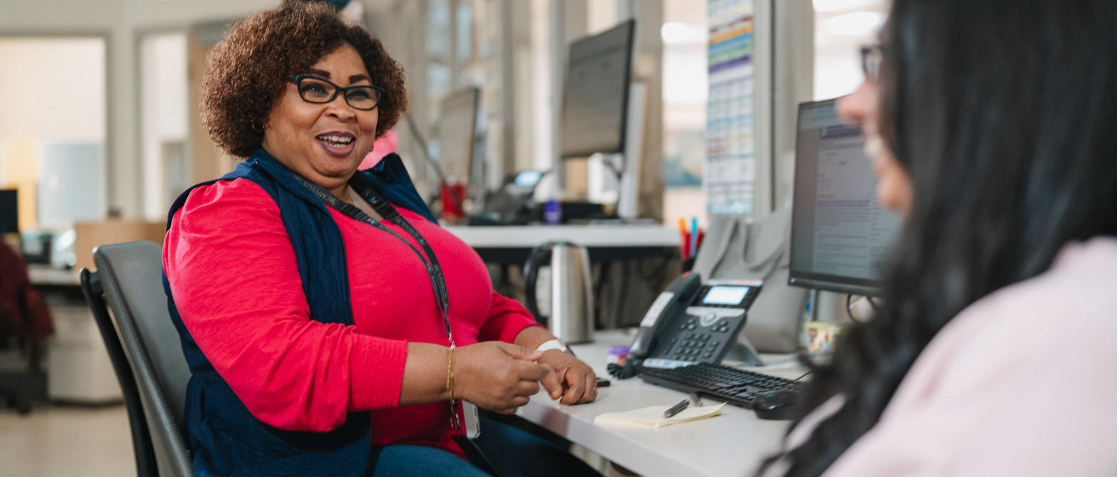 A BCMHSUS support worker at their desk